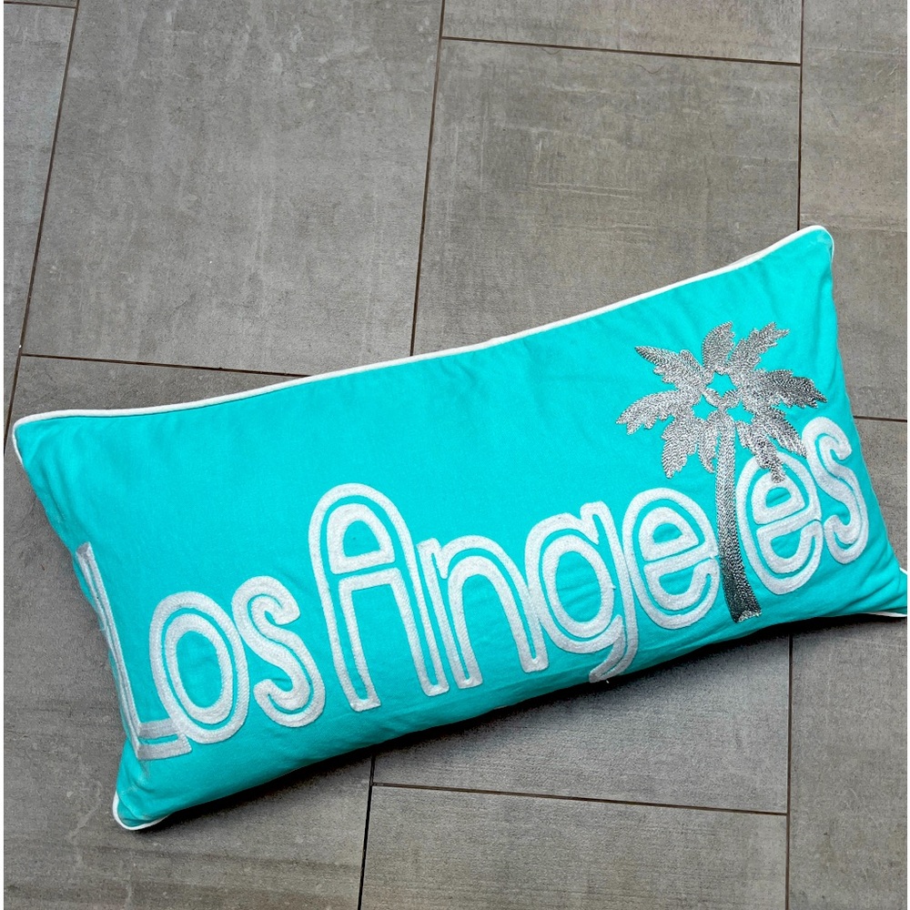 Fun Los Angeles pillow: turquoise with white letters & metallic silver palm tree